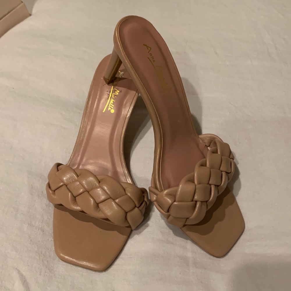 Faux leather taupe slides with square toe and braided front.